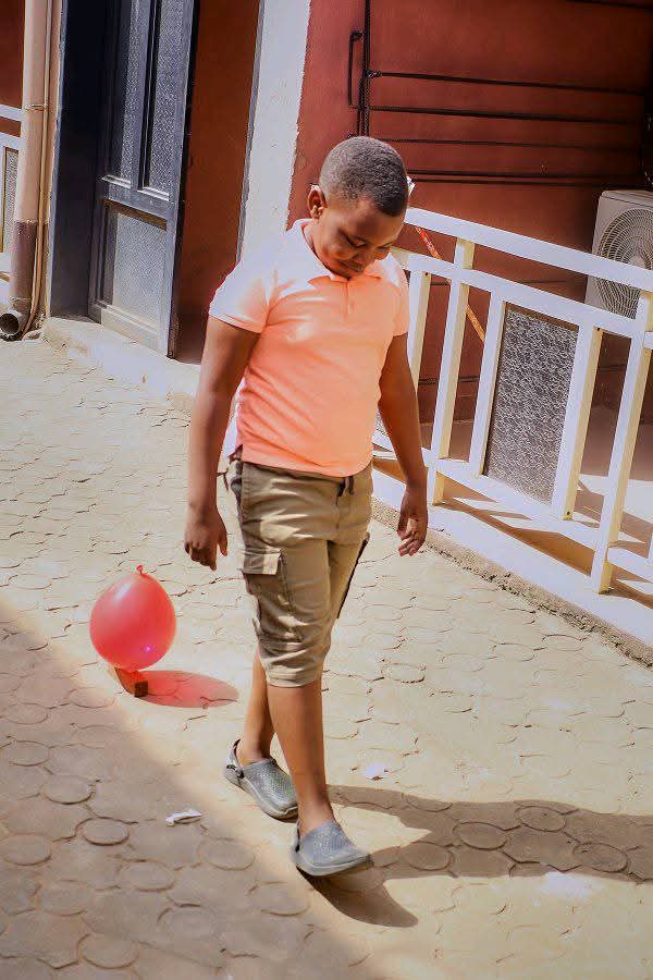 Child with balloon during outreach