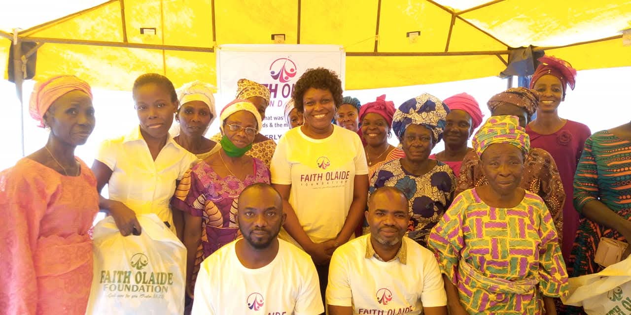 Foundation team with widows and community beneficiaries